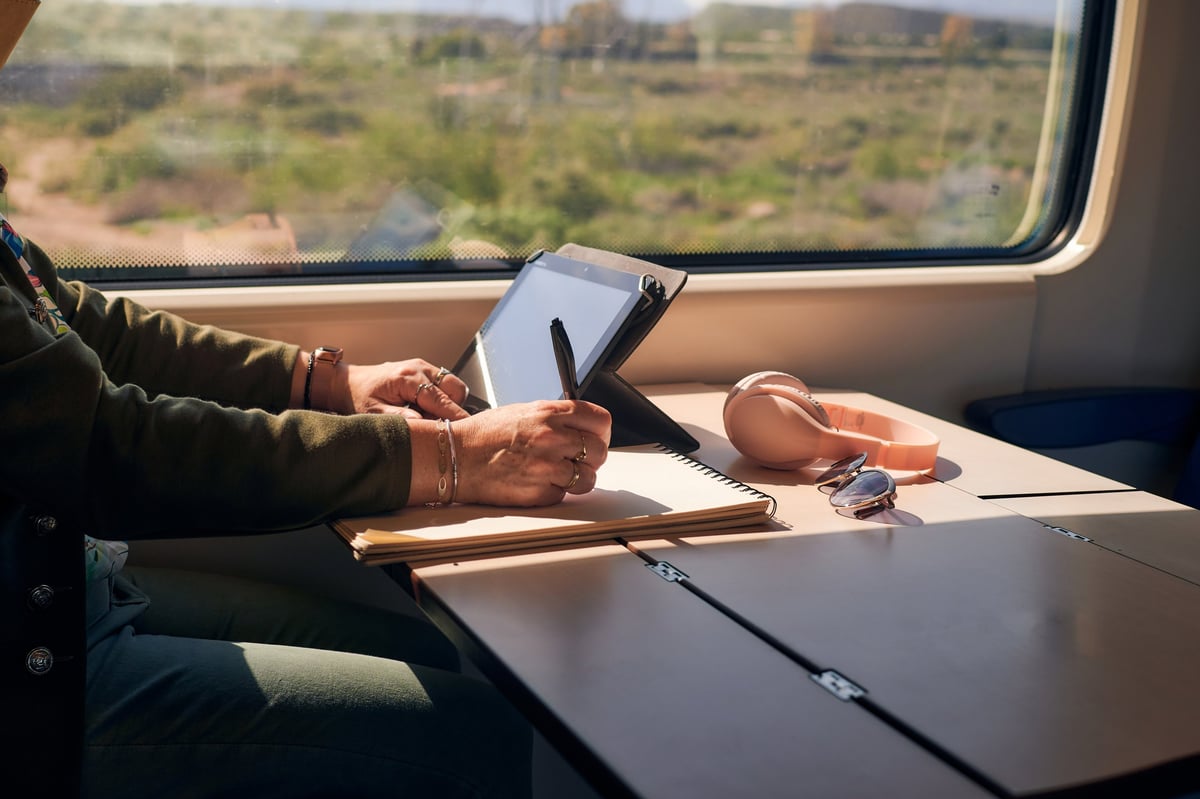 Passenger working comfortably from their train seat
