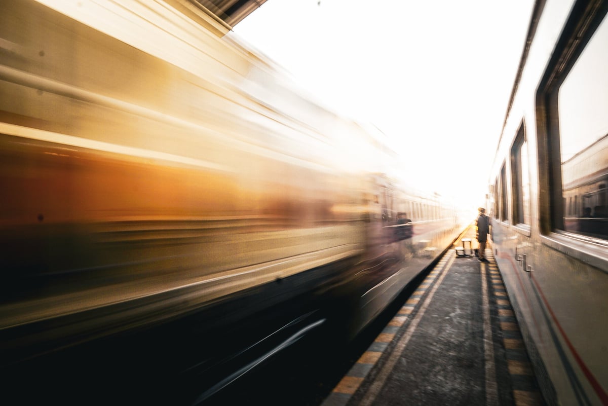 Train passing a station platform at high speed